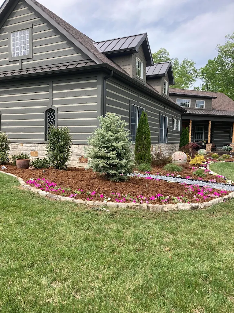 A planted entrance and cared-for lawn at a home
