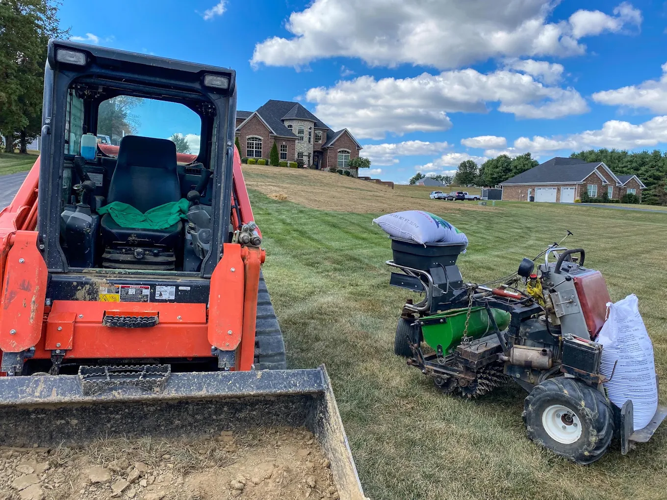 Lex equipment on site for lawn preparation and seeding