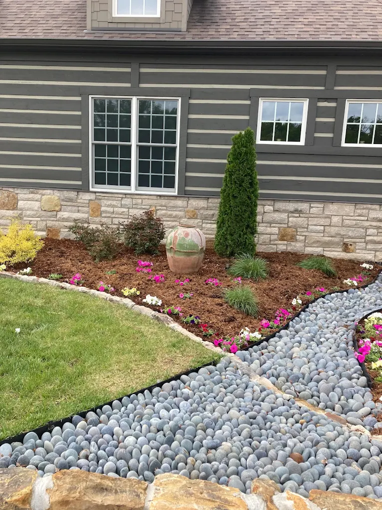 A planted entrance with stone borders